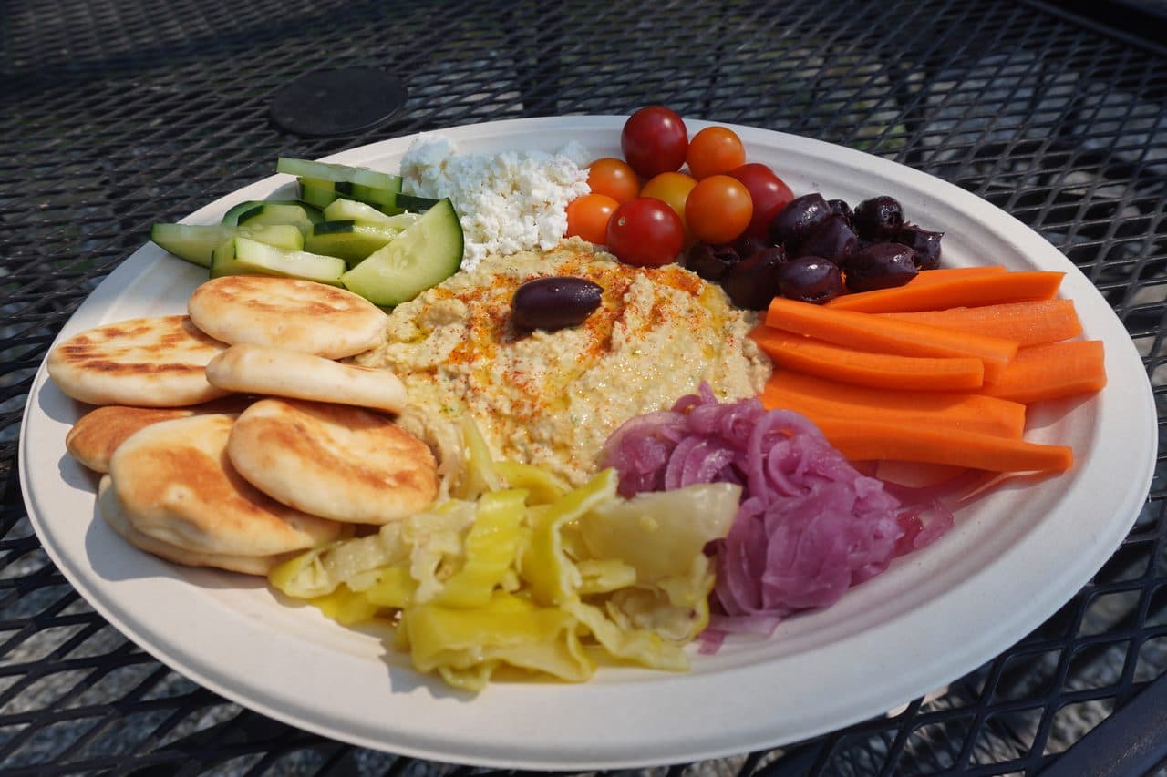 A loaded hummus plate