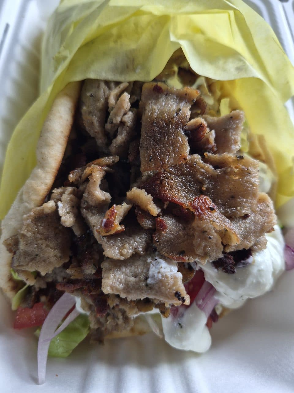 A traditional gyro wrapped in warm pita